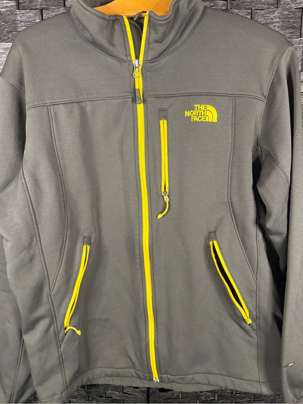 The North Face Men's Gray Jacket with Yellow Zippers